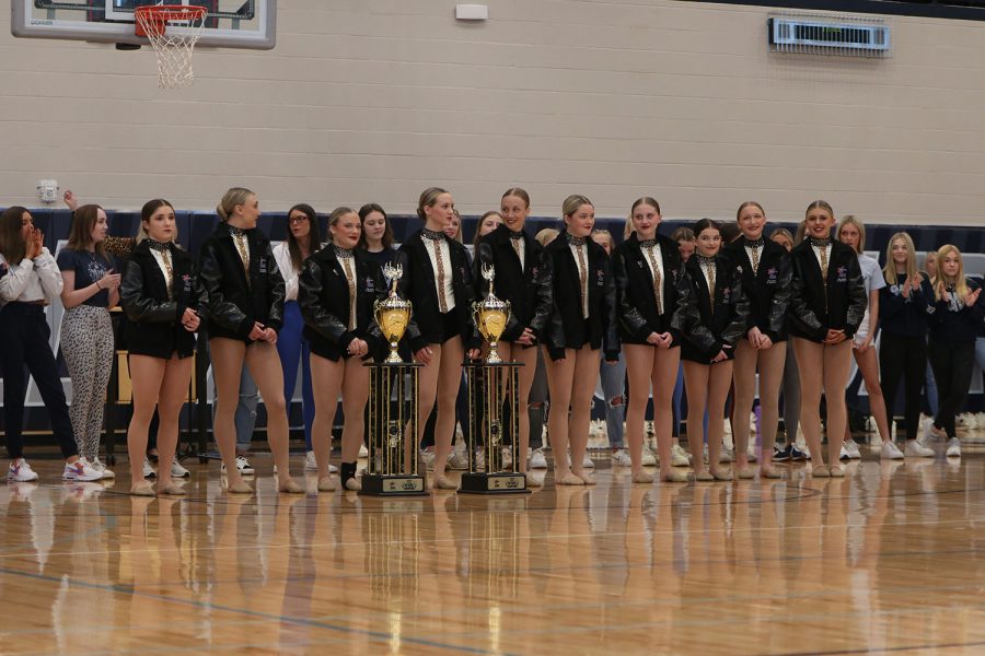 With their trophies in front of them, the silver stars are recognized for their two national championships.