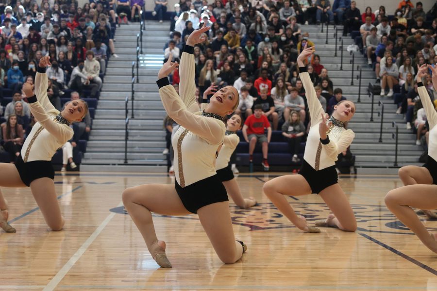 Arms raised, sophomore Trinity Baker continues the silver stars jazz performance.