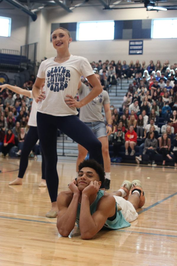 At the end of the silver studs performance, senior Adrian Dimond striked a pose on the ground with senior Hailey Mahoney standing above him.