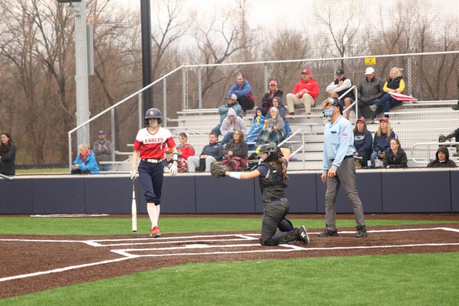 After an opposing player strikes out, sophomore Elly VanRheen catches the ball and begins to throw back to the pitcher.