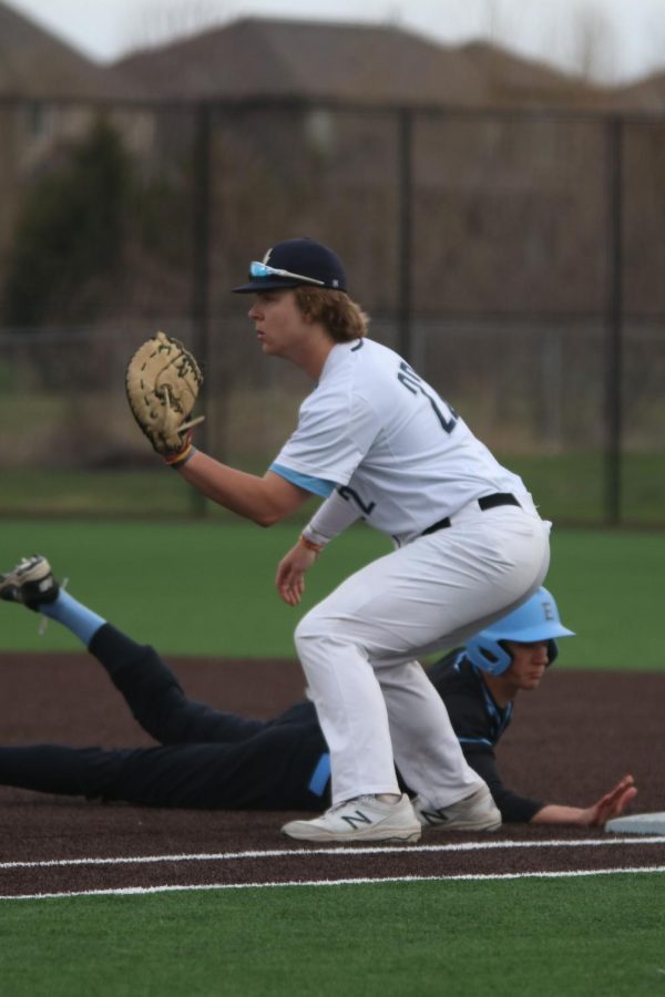Senior Trent Gietzen catches the ball in an attempt to get a Shawnee Mission East player out. 