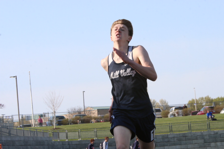 Eyes up, junior Dylan Miller strides out to the finish line to toward the end of the 400-meter dash.