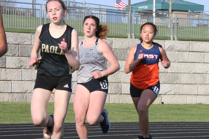 Rounding the track, senior Anna Brazil stays on the heels of her opponent during the 800-meter race.