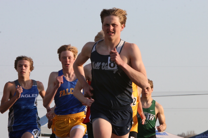 After crossing over into the closest lane, senior Jacob McGlasson leads the for the first half of the 800-meter race.
