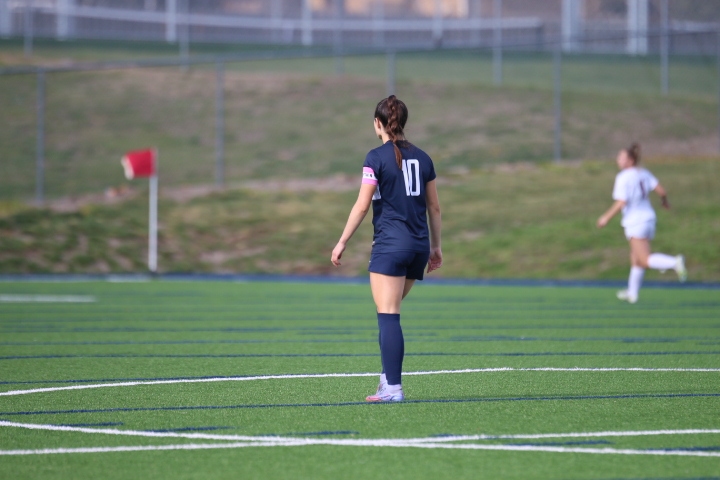 Junior Gracie Knight watches her teammates dribble to the goal making the score 2-3. 
