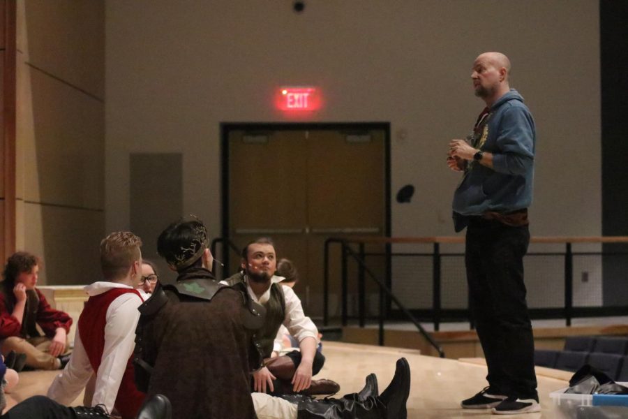 In preparation for the final dress rehearsal Monday, April 18, drama teacher Jonathan Copeland gives a pep talk to the cast and crew of students participating in the play A Midsummer Nights Dream.