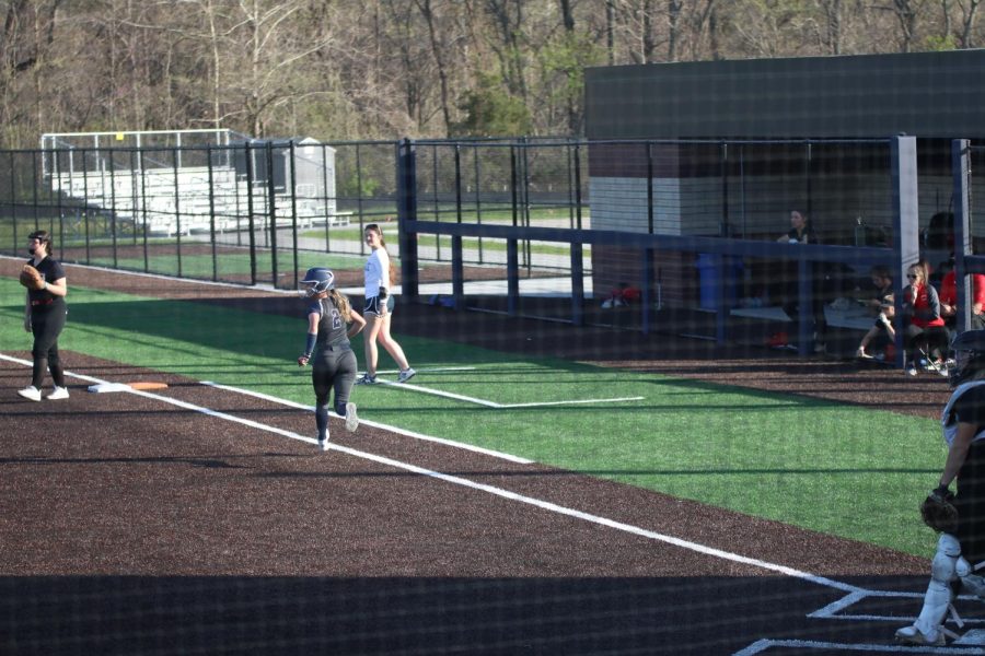 Hitting a single, senior Reece Cole watches to see if Lawrence will catch the ball