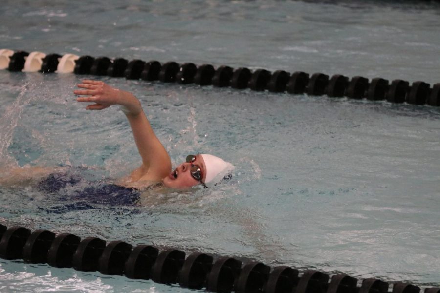 Freshman Cora Jones competes in the 100 meter freestyle at Blue Valley Northwest. 