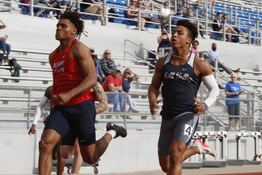 Neck and neck with Olathe Norths Jacob Parrish, junior Sidney Lockhart would go on to finish three hundredths of a second behind Parrish earning second place in the 200 meter dash with a time of 10.71 seconds.