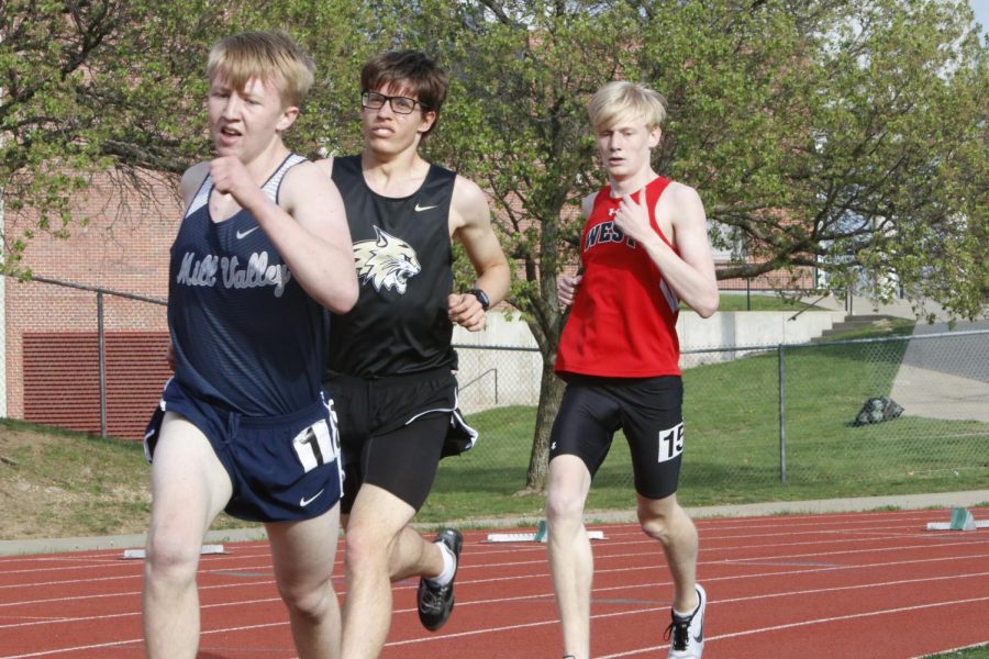 Sophomore Robert Hickman leads two runners in the 1600 meter race. Hickman took 14th in the race with a mile time of 5:05.