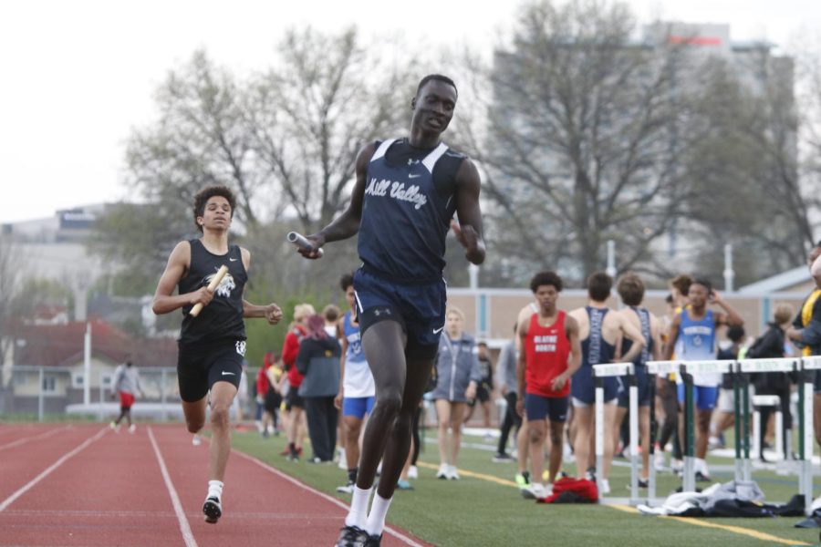 Crossing the finish line at last, junior Nen Matlock anchors for the 4x400 meter relay. Matlock, along with seniors Aiden Burke, Chase Schieber and Krist Twigg helped the relay team place fourth.