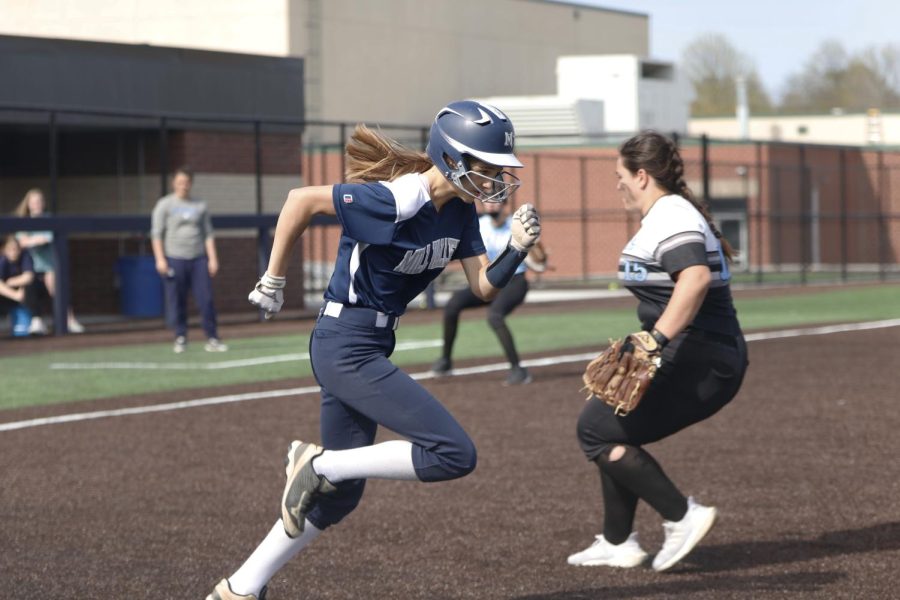 Freshman Averie Landon runs to first base after getting a hit during the second inning in the first game