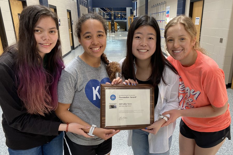 The four editors of Mill Valley News, juniors Avery Gathright, Gabby Delpleash and Ally Sul and senior Damara Stevens accept their plaque at school Monday, April 12