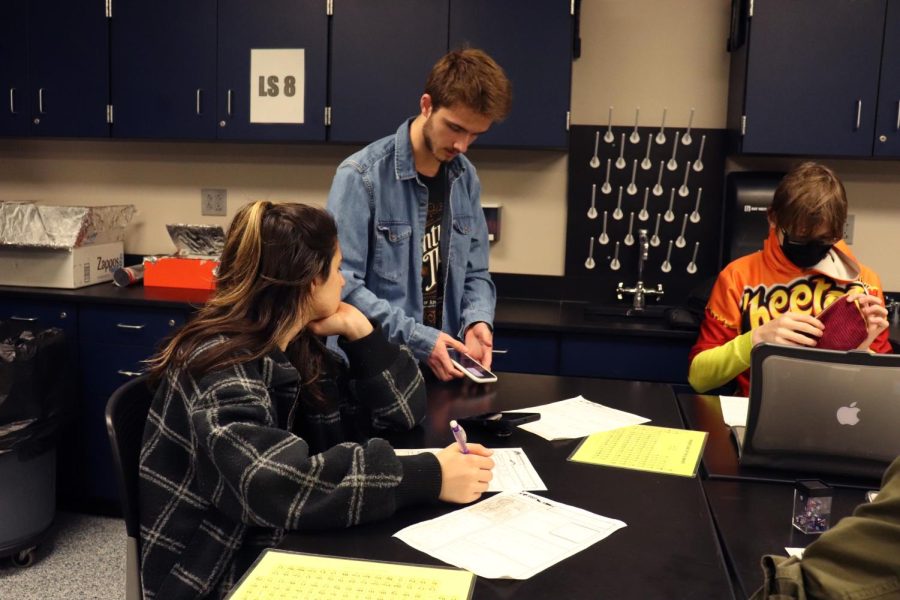 Senior Mason Mullen guides Brianna Bruno through the trials and tribulations of Dungeons and Dragons on Friday, March 25th. 