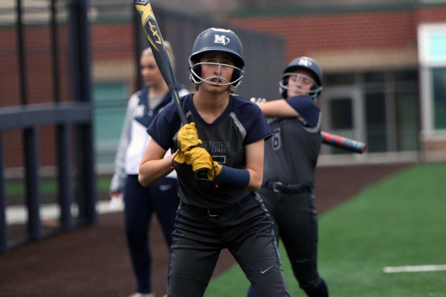 Freshman Madison Lehr and freshman Ashley Bryant practice their batting skills.