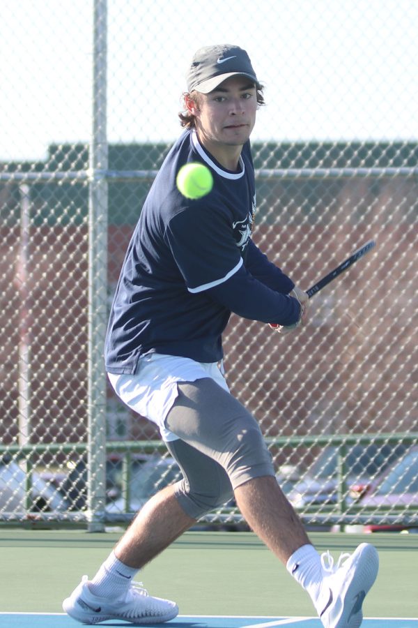Eye on the ball, senior Gage Foltz stays focused during his match Friday, April 1.
