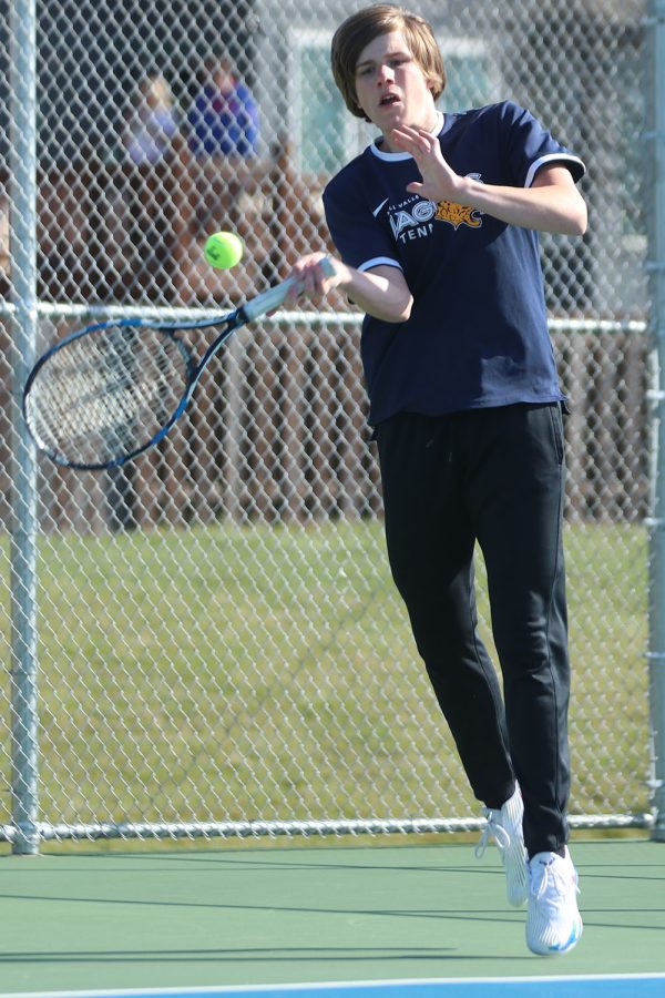 Racket up, senior Derek Mulder hits the ball back to his opponent Friday, April 1.
