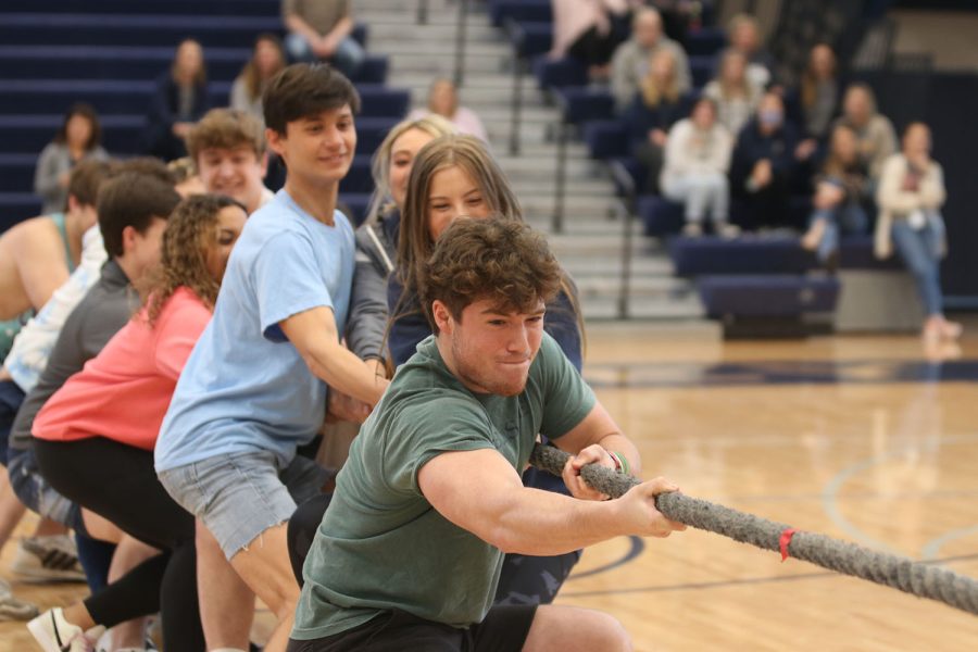 In deep concentration, senior John Teska tries to win against the junior class in tug of war Friday, April 1.
