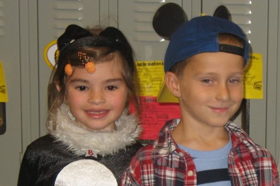 Dressed up in Halloween costumes, six-year-olds Grace Emerson and Noah Webber smile for a picture together before their elementary school costume parade Friday, Oct. 29 2010.