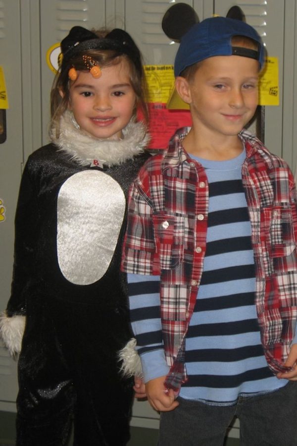 Dressed up in Halloween costumes, six-year-olds Grace Emerson and Noah Webber smile for a picture together before their elementary school costume parade Friday, Oct. 29 2010.