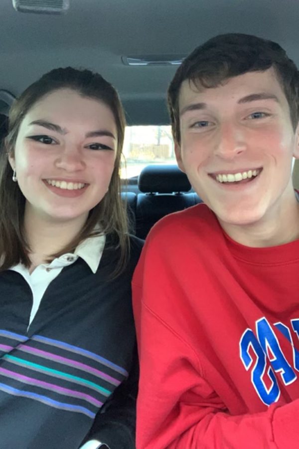 Sitting beside each other in the car, seniors Grace Emerson and Noah Webber take a selfie together before their first day of senior year Friday, Aug. 13.