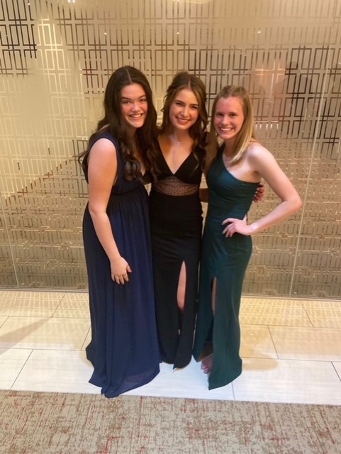 Pfiester, Schwartzkopf and Wootton celebrate their senior prom which was hosted at Arrowhead Stadium Saturday, April 2.