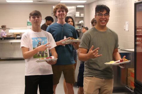 Walking out of the school’s kitchen for the last time, seniors Ryan Cohara, Henry Coulson and Alex Vinh pose for a photo. 