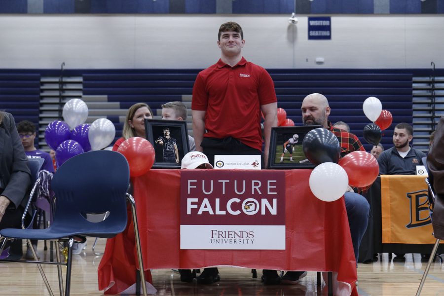 Senior Payton Douglas signs to play football at Friends University.