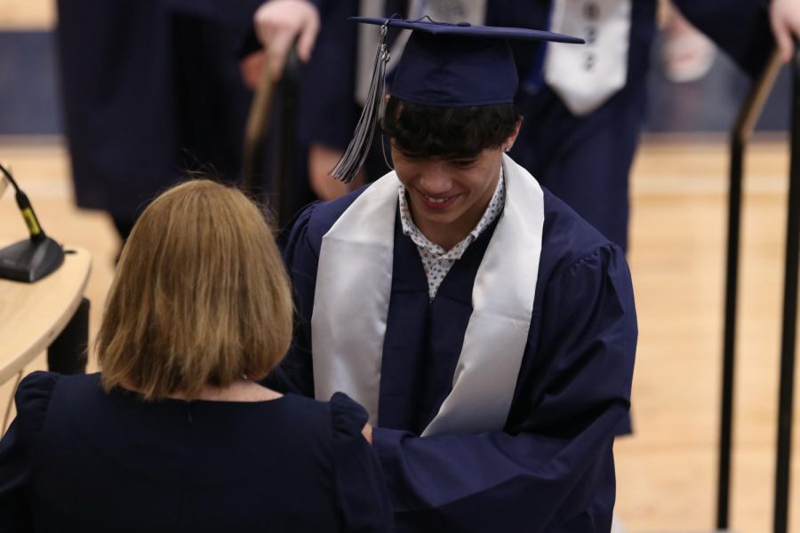 With a smile oh his face, senior Blake Boatwright receives his diploma. 