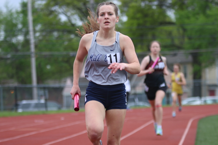 Sophomore Ellie Walker grips the baton as she runs the third leg of the 4x800 meter relay Friday, May 6. Walker contributed to the relay team finishing 16th overall out of 19 schools.
