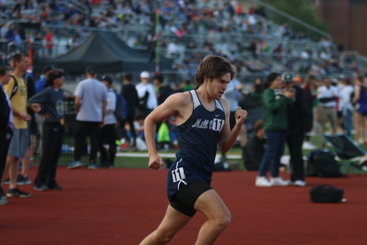 Rounding the track on the second lap, senior Chase Schieber competes in the 1600 meter run. Schieber would go on to finish the race in ninth place with a mile time of 4:21 seconds. Schieber is currently ranked in the state top 10 for his performance in the 1600 meter race.