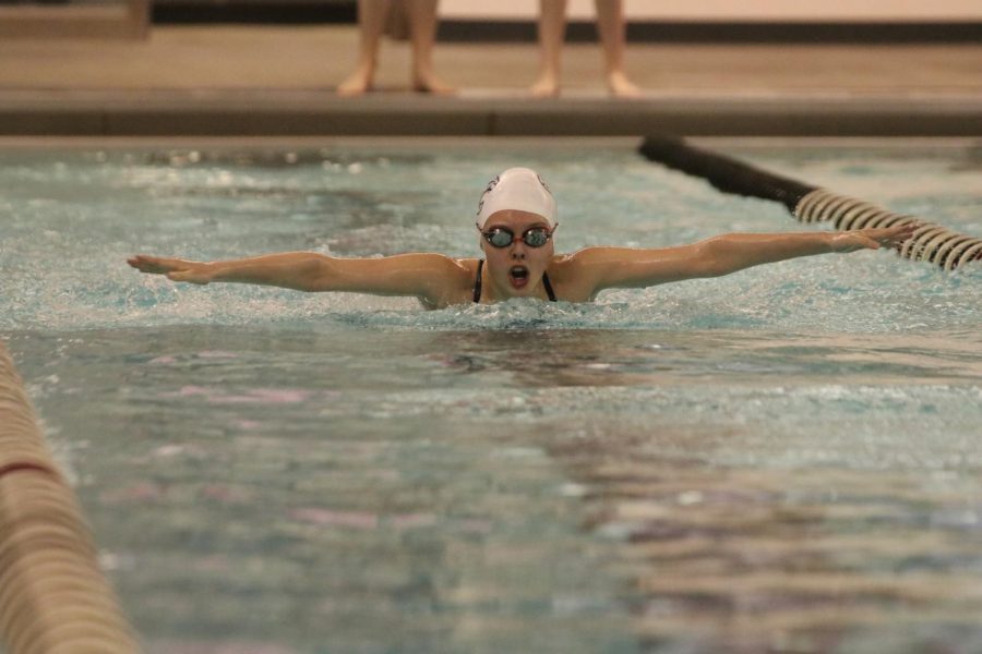 Breaking the surface, freshman Cora Jones competes in the 200 individual medley at Blue Valley Northwest Thursday April 28.