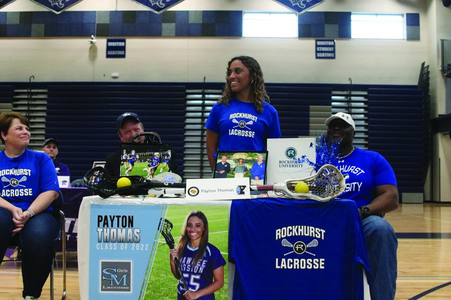 Senior Payton Thomas signs to play lacrosse at Rockhurst University.
