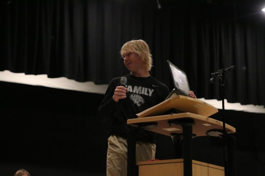 Looking to the side of the stage, freshman Acy VanRheen finishes his candidate speech.