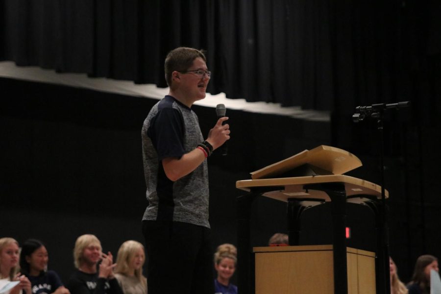 Holding the mic, freshman Ian Weatherman makes a joke during his candidate speech.