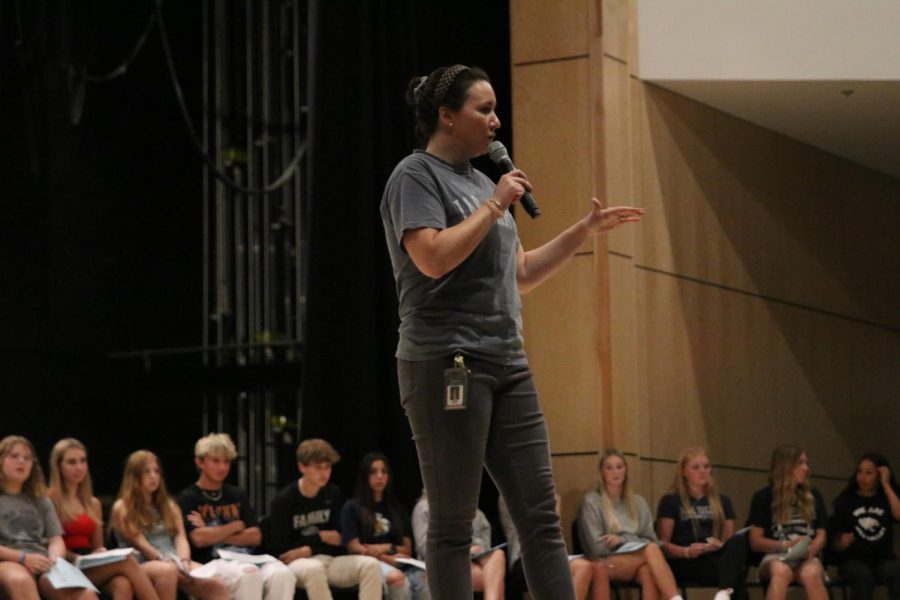 At the conclusion of freshman speeches, StuCo sponsor Erica Matyak addresses the crowd on how to vote for class representatives.
