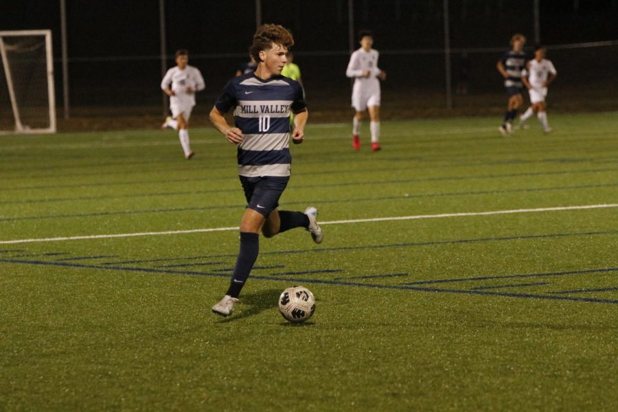 Senior Nico Pendleton dribbles the balls whilst looking for a teammate to pass to.
