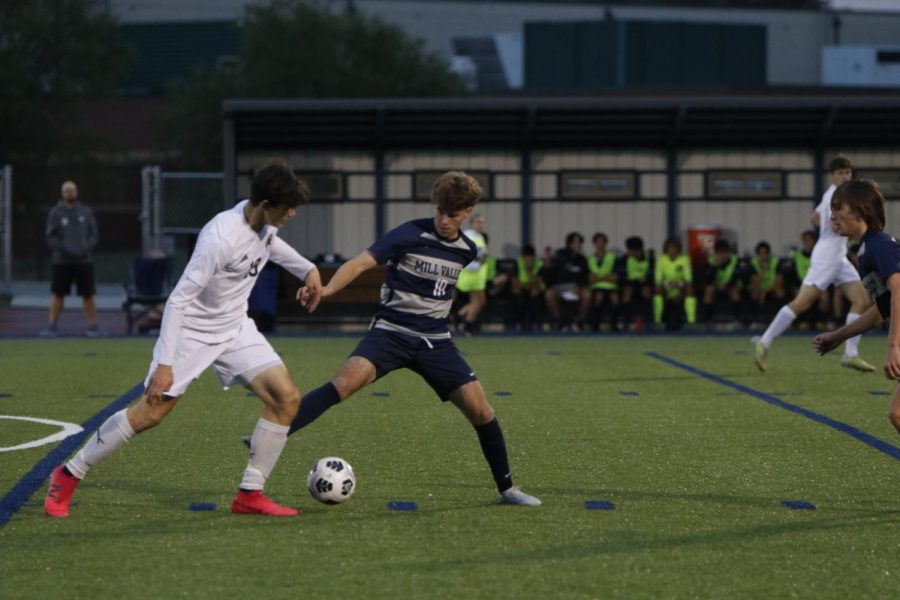 Senior Nico Pendleton attempts to steal the ball from a Gardner-Edgerton player.