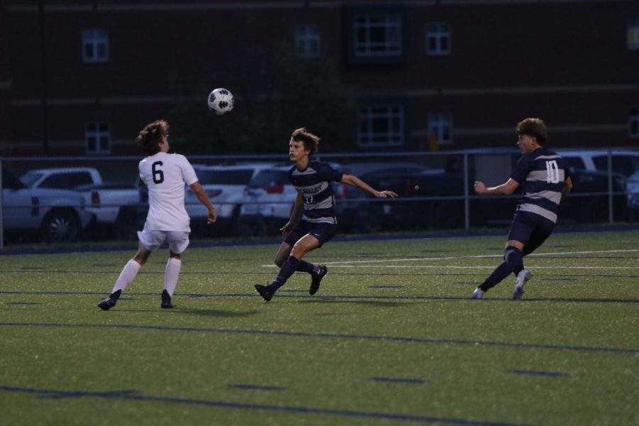 With the ball in midair, sophomore Brady Robins goes for a header.