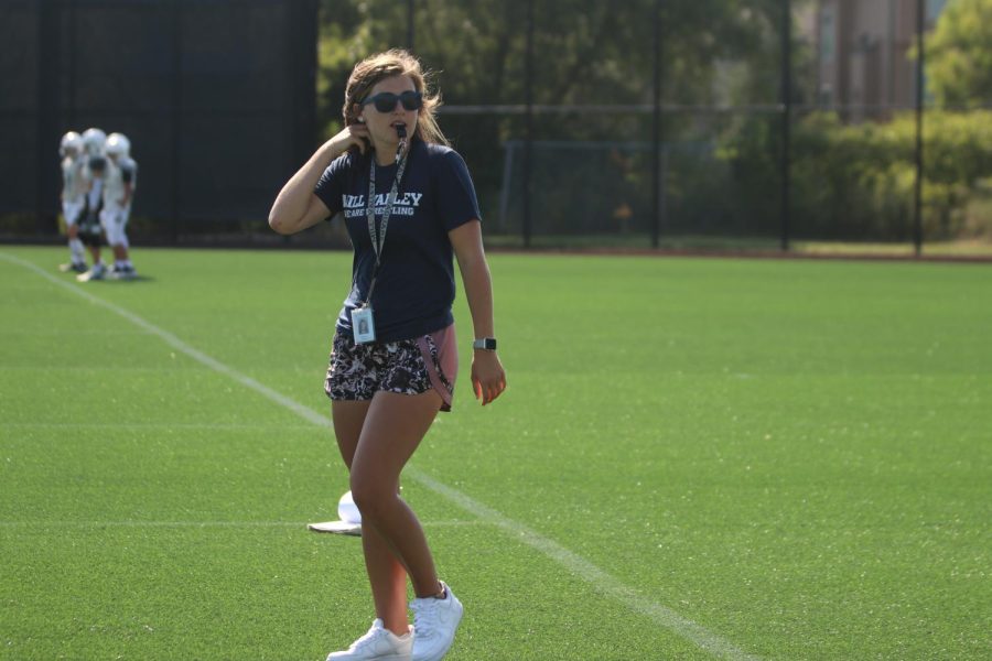 Coach Michelle McRay blows her whistle during middle school football practice Tuesday, September 8.  