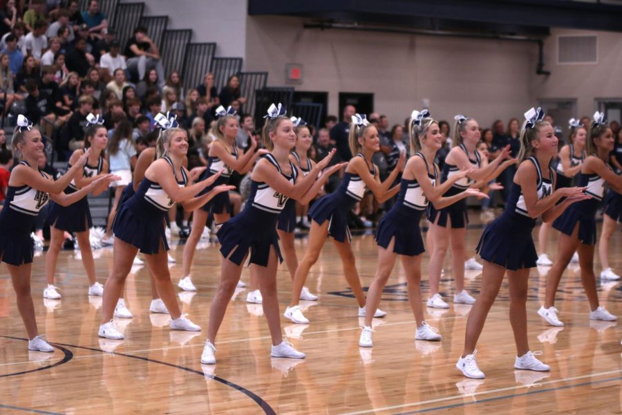 In sync, the Mill Valley cheer team claps during their performance at the pep assembly.