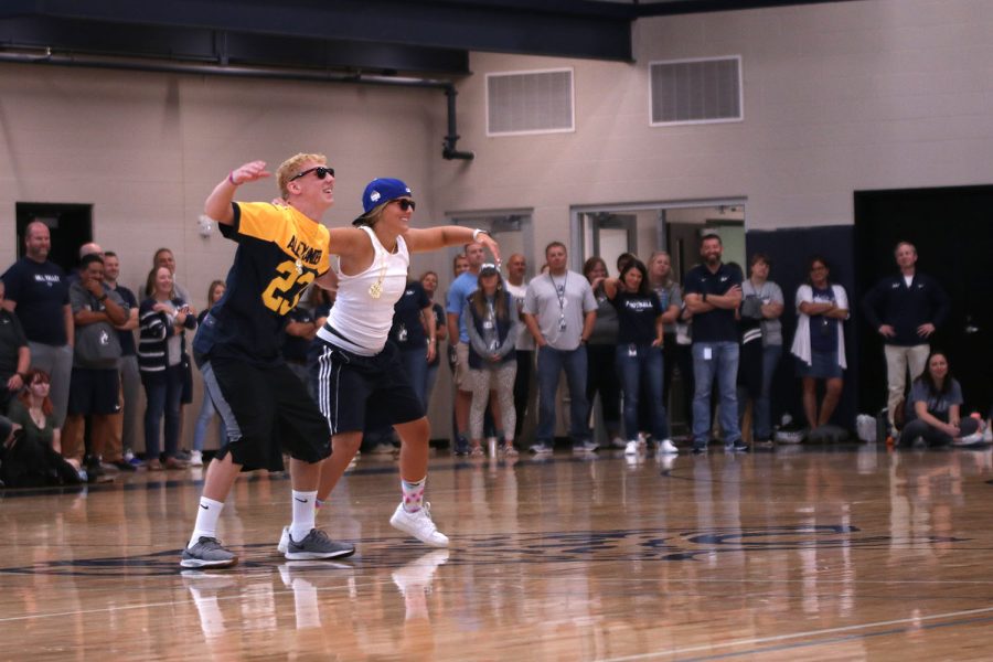 Senior Homecoming candidates Mikey Bergeron and Avery Blubaugh, dance with their arms around each others backs. Bergeron and Blubaugh won first place out of the rest of the candidates with their dance.