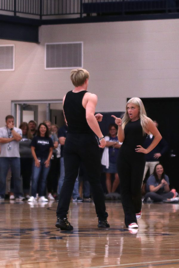 With hand on her hip, senior Homecoming candidate Brianna Coup points at senior Homecoming candidate Hayden Jay while performing to Youre The One That I Want from “Grease.”