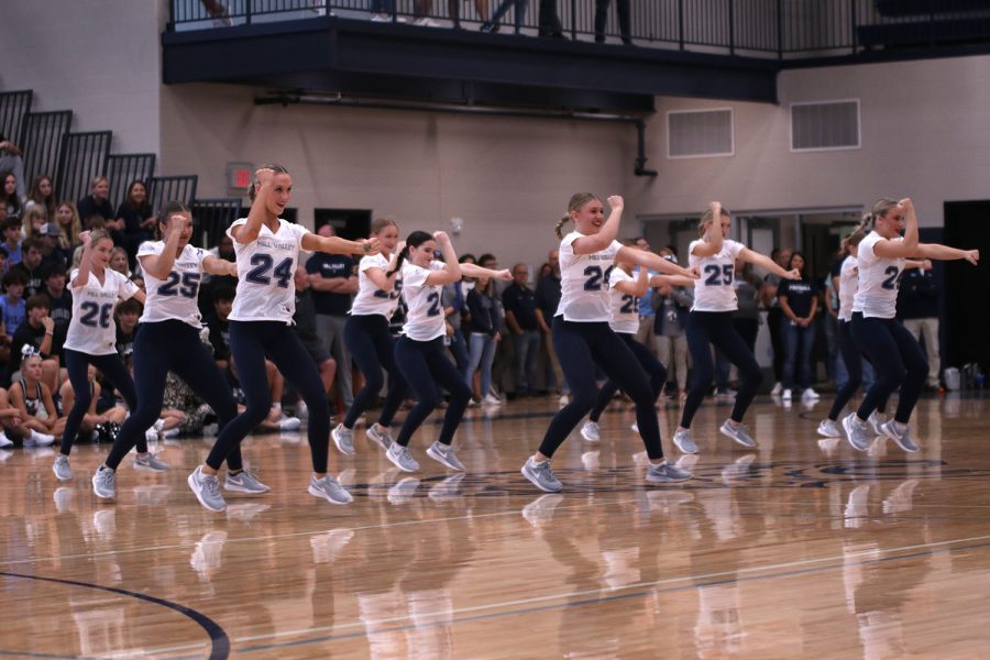 In unison, the Silver Stars dance at the Homecoming pep assembly.