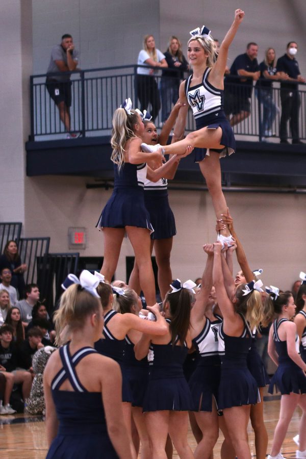 In a stunt, senior Lucy Pearce prepares to do a backflip.