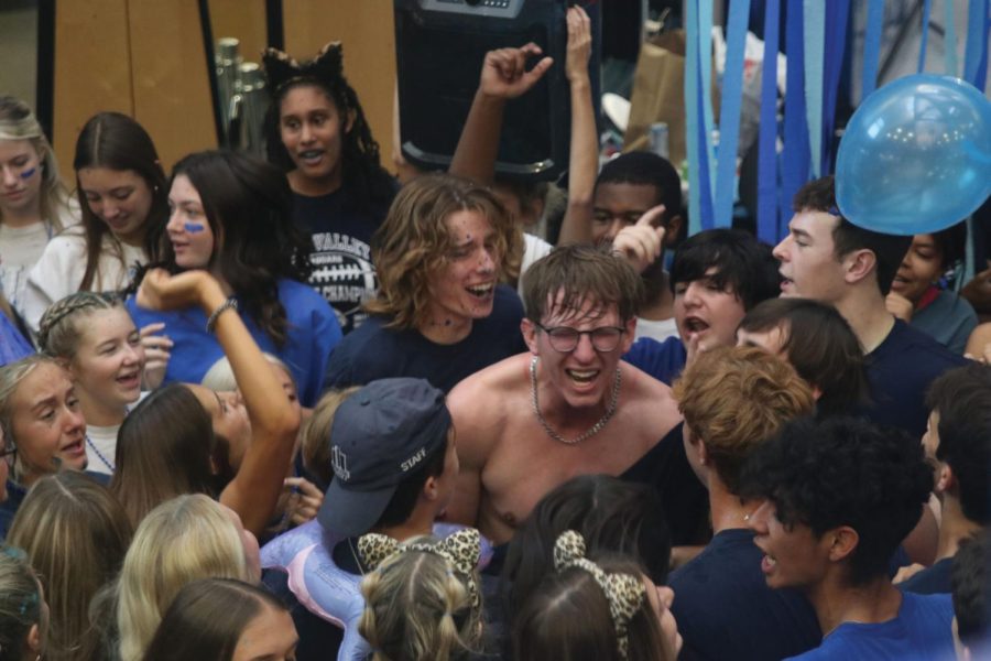 Seniors Max Weber and Toby Kornis stand in the middle of the mosh pit at the end of Blue Bomb.
