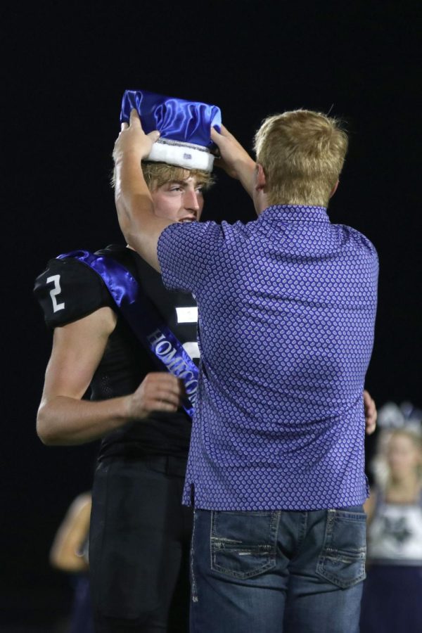 Last year’s Homecoming king Cody Moore, crowns senior Homecoming King Hayden Jay.