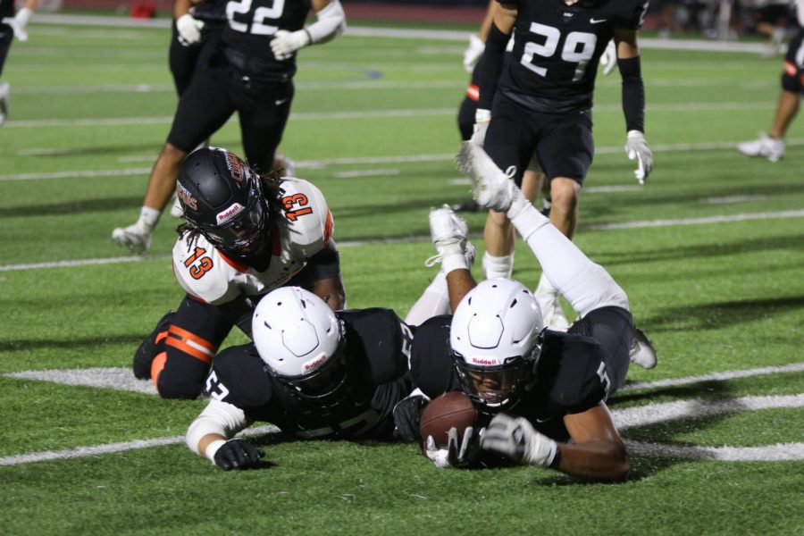 Sophomore Jayden Woods recovers the fumble.