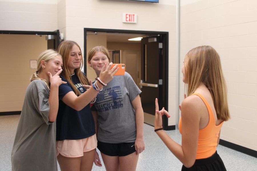 Juniors Samantha Mullen, Allison Mulder, Jenna Graber and Faith Parker take a photo on the popular app, Be Real, Friday, Sept 2.