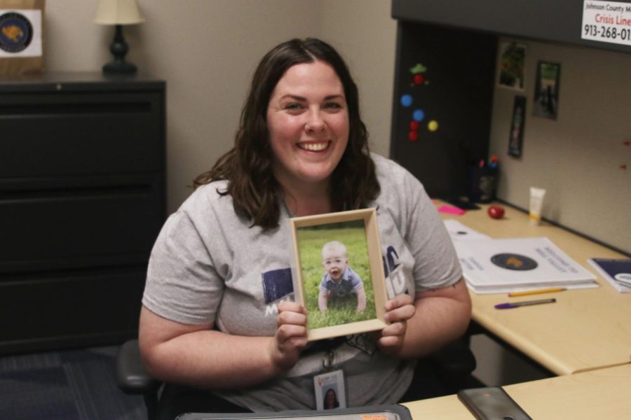 Excited to help out students, new social worker Tawnya Bettis holds up a picture of her son on September 2. My goal for Mill Valley would be to support the students here and just help everybody feel like they belong, said Bettis.